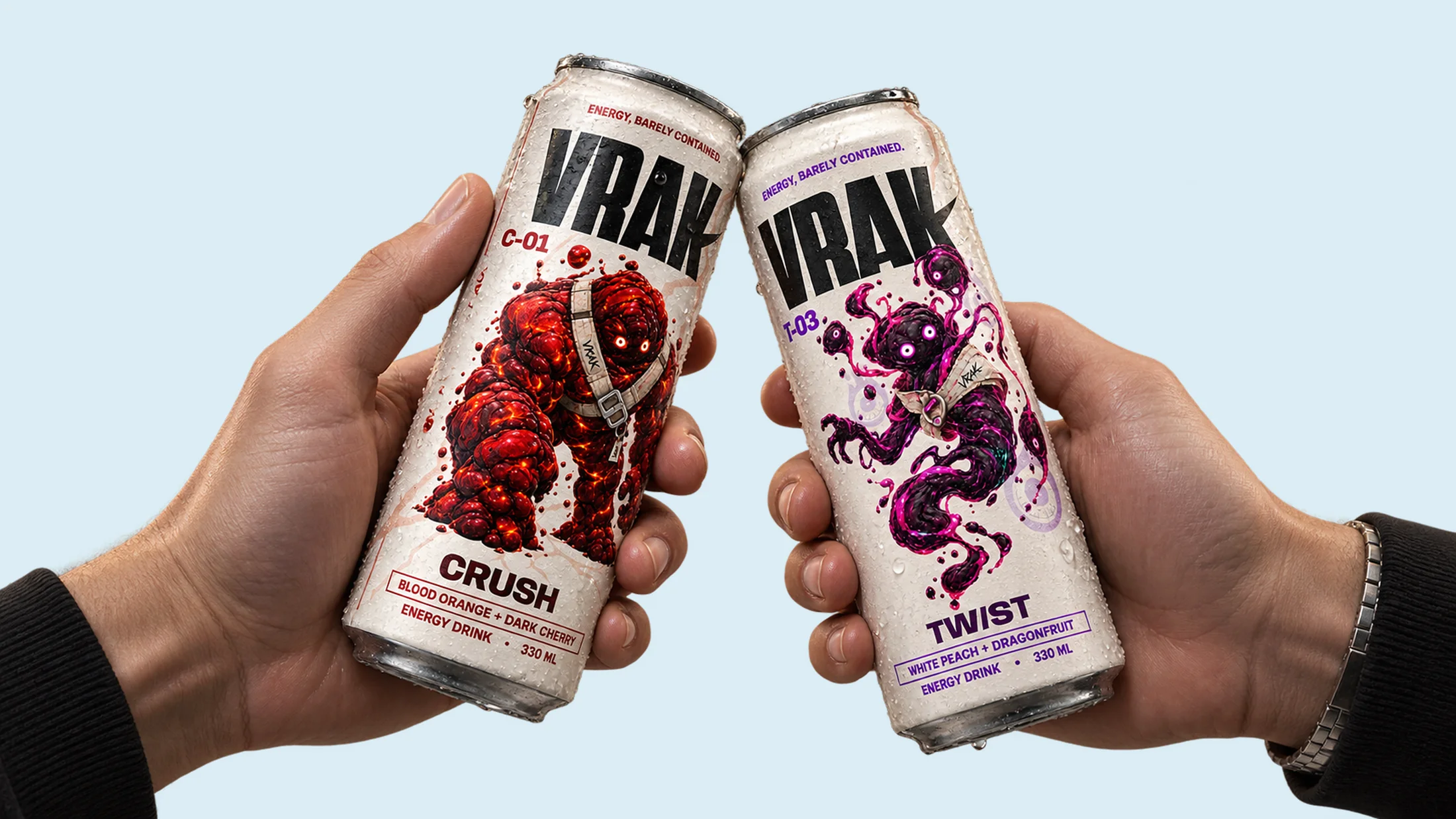 Hands holding VRAK beverage cans